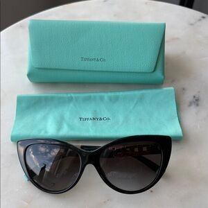 Tiffany T
Sunglasses in Black Acetate with Dark Gray Lenses cat eye authentic